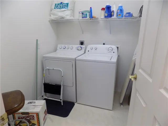a utility room with dryer and washer