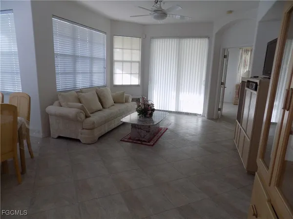 a living room with furniture and a window