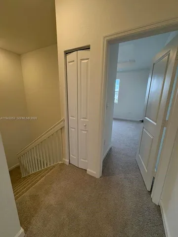 a view of hallway with stairs