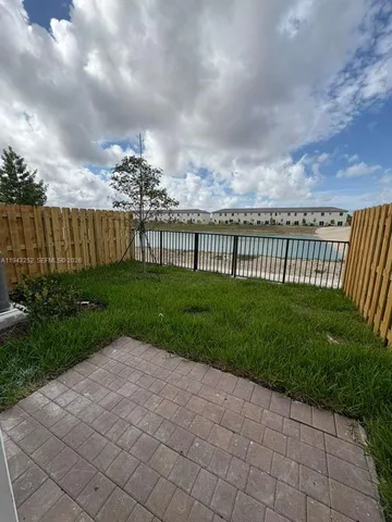 a view of a pathway with a yard