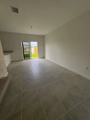 a view of empty room with windows