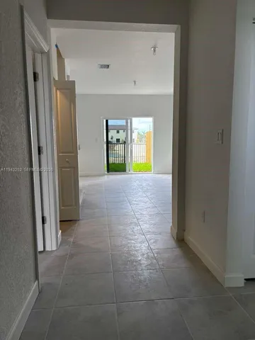 a view of hallway with natural light