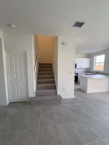 a view of a kitchen with electric appliances