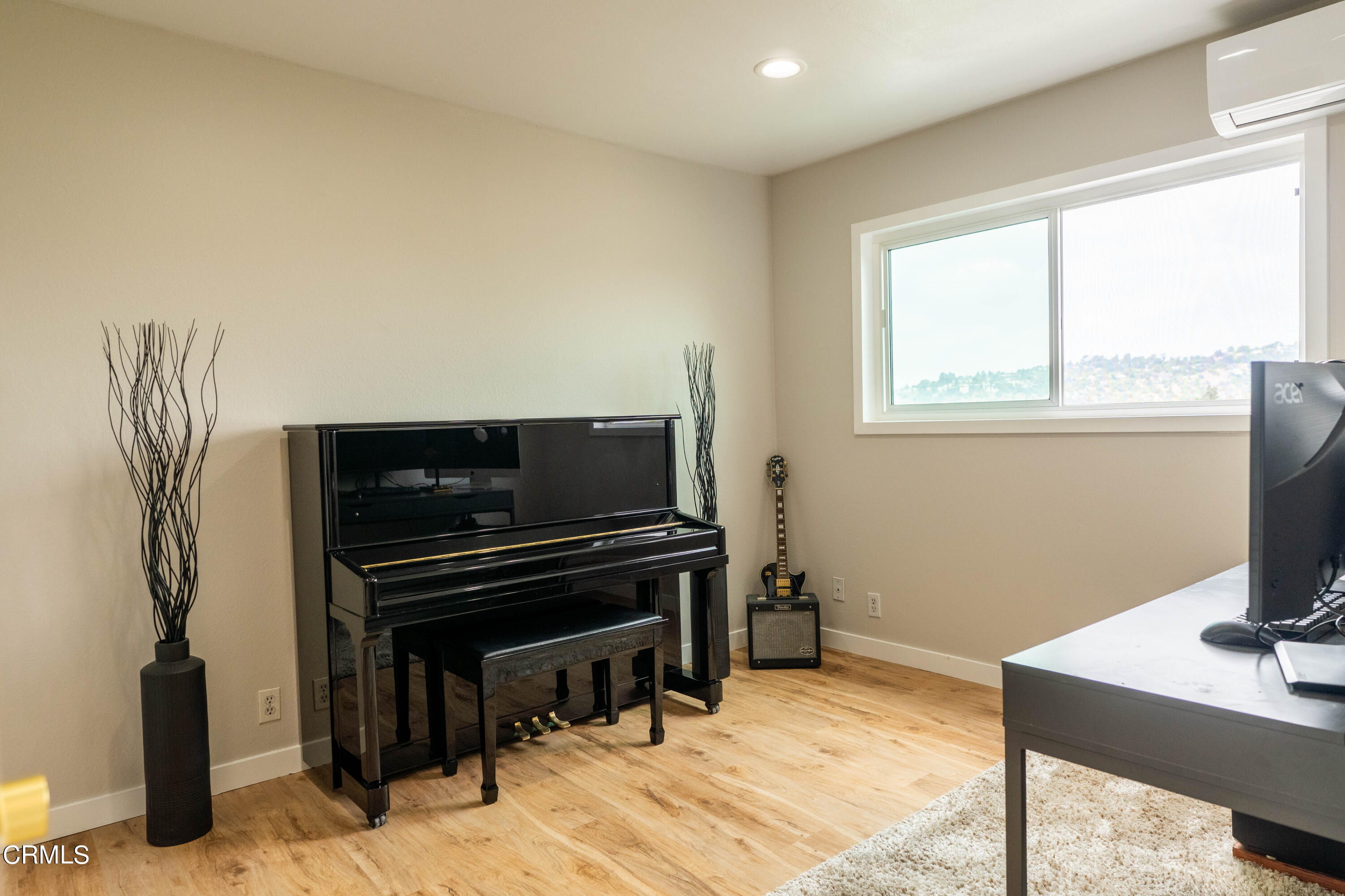 5850 Benner Street, Unit 306 Los Angeles, CA 90042 - Photo 12 of 29 a bedroom with a bed and a desk
