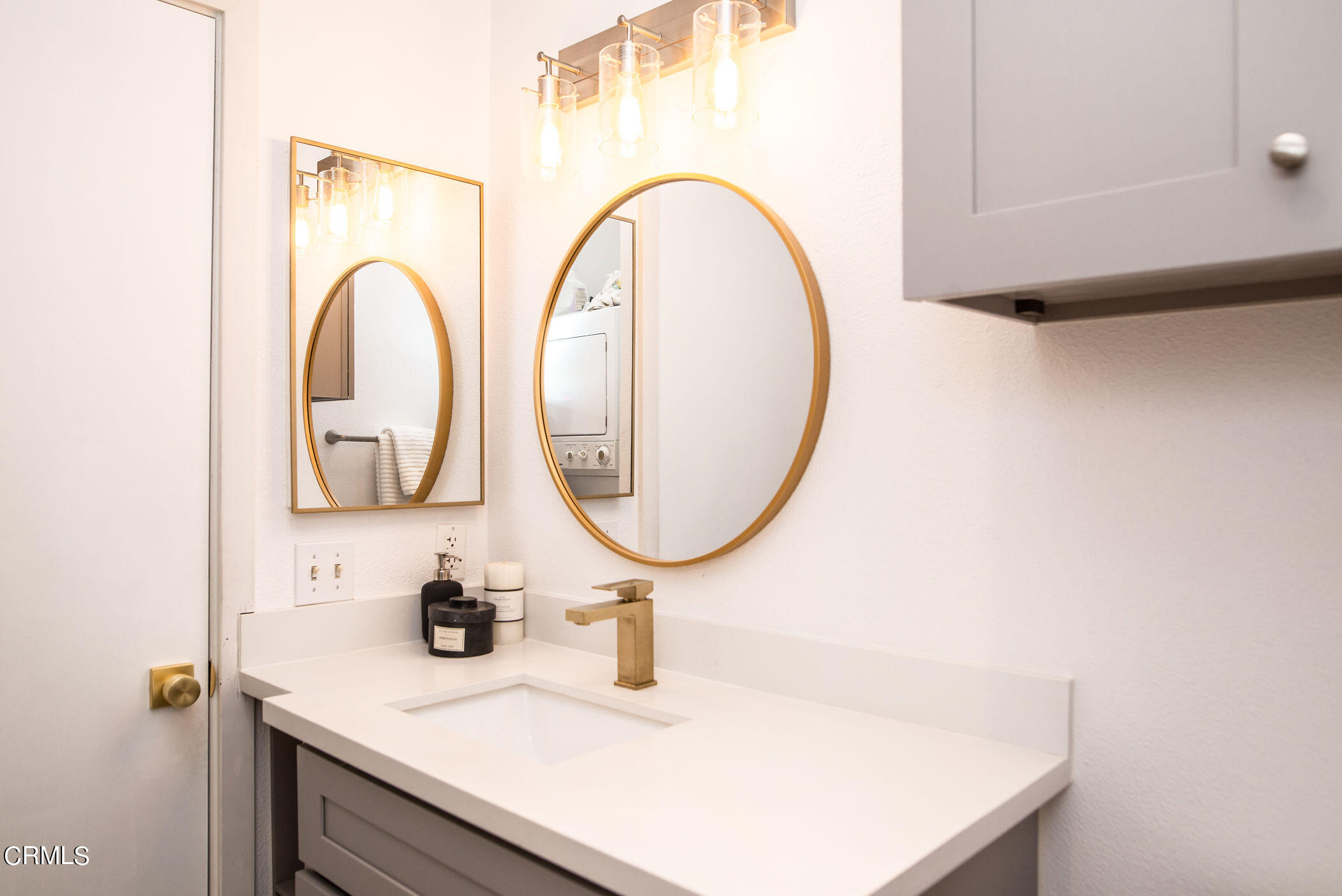 5850 Benner Street, Unit 306 Los Angeles, CA 90042 - Photo 14 of 29 a bathroom with a sink and a mirror