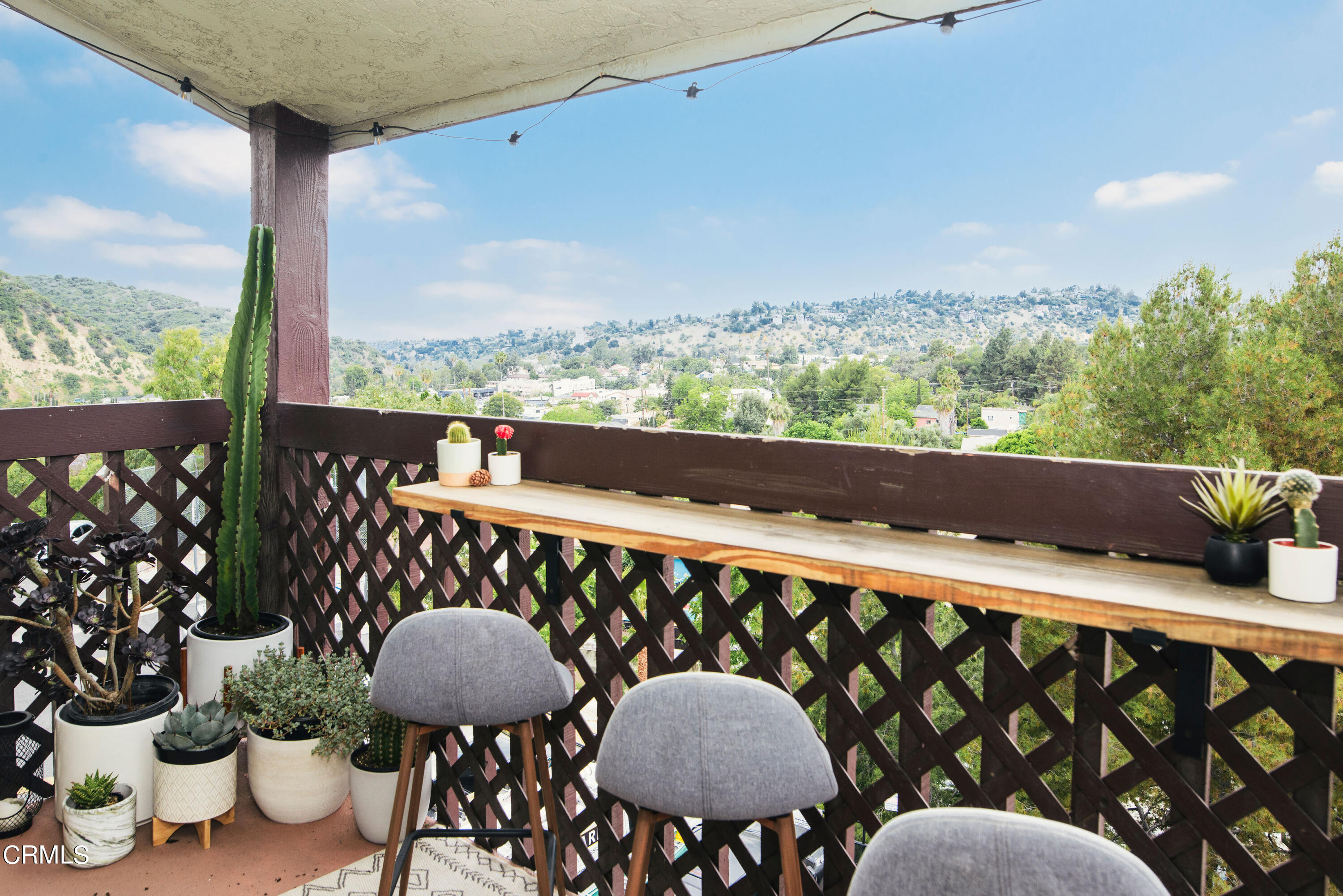 5850 Benner Street, Unit 306 Los Angeles, CA 90042 - Photo 18 of 29 a balcony view with couple of chairs