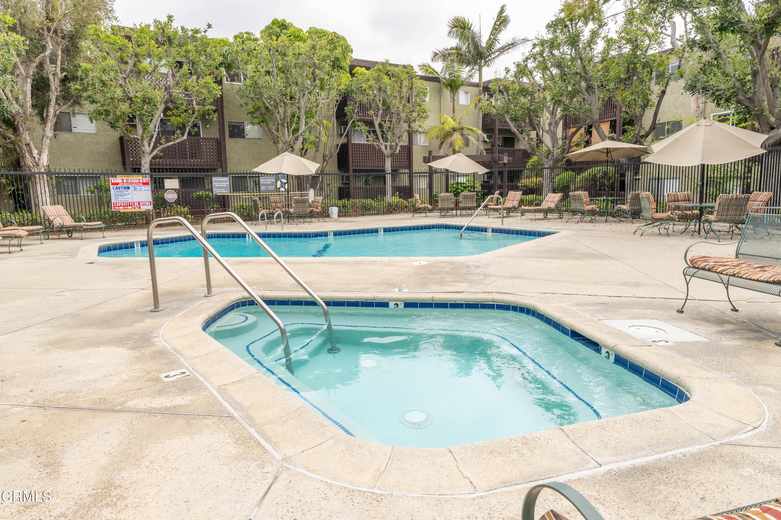 5850 Benner Street, Unit 306 Los Angeles, CA 90042 - Photo 21 of 29 a view of a swimming pool with an outdoor seating