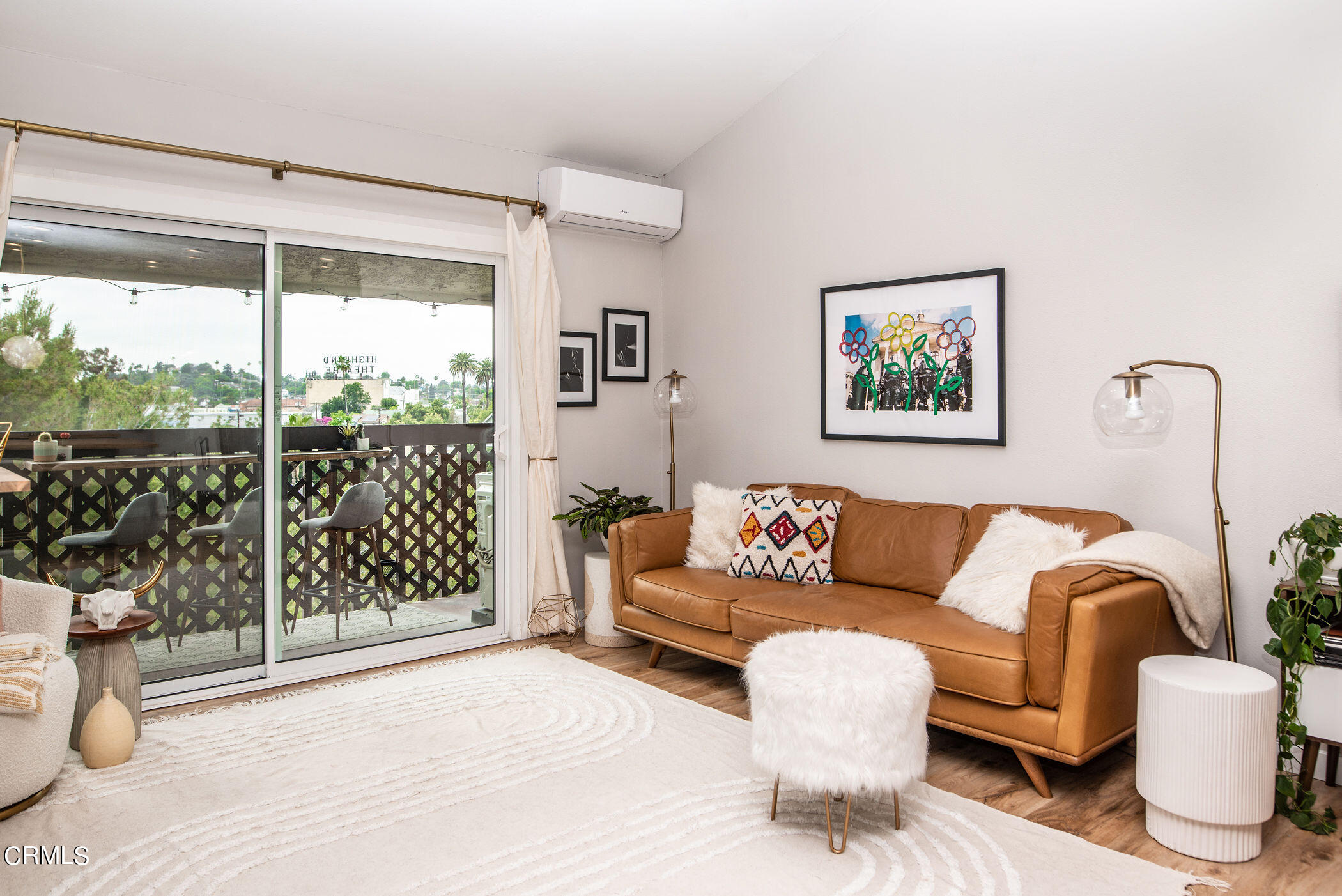 5850 Benner Street, Unit 306 Los Angeles, CA 90042 - Photo 5 of 29 a living room with furniture and a large window