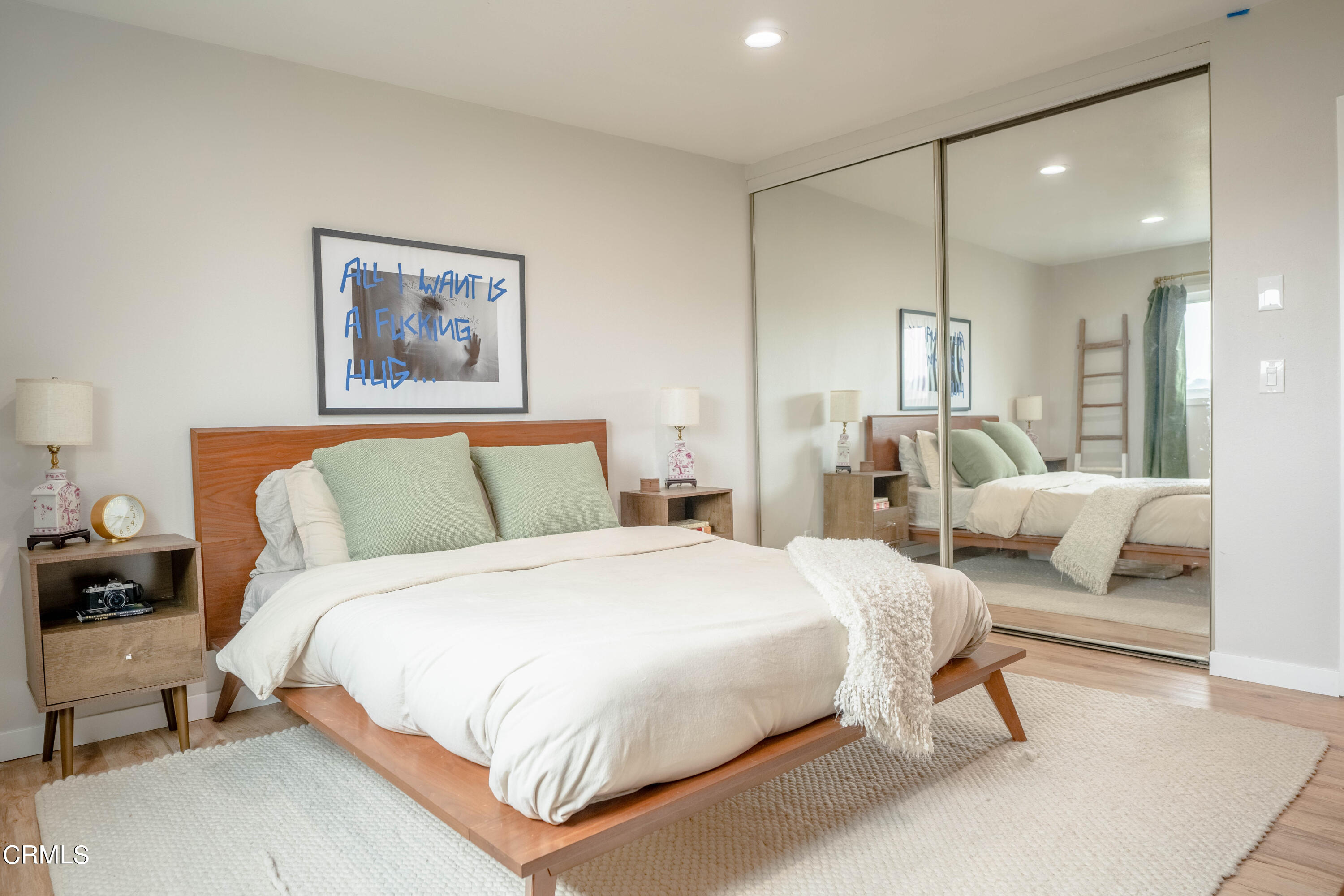 5850 Benner Street, Unit 306 Los Angeles, CA 90042 - Photo 9 of 29 a bedroom with a bed and a couch