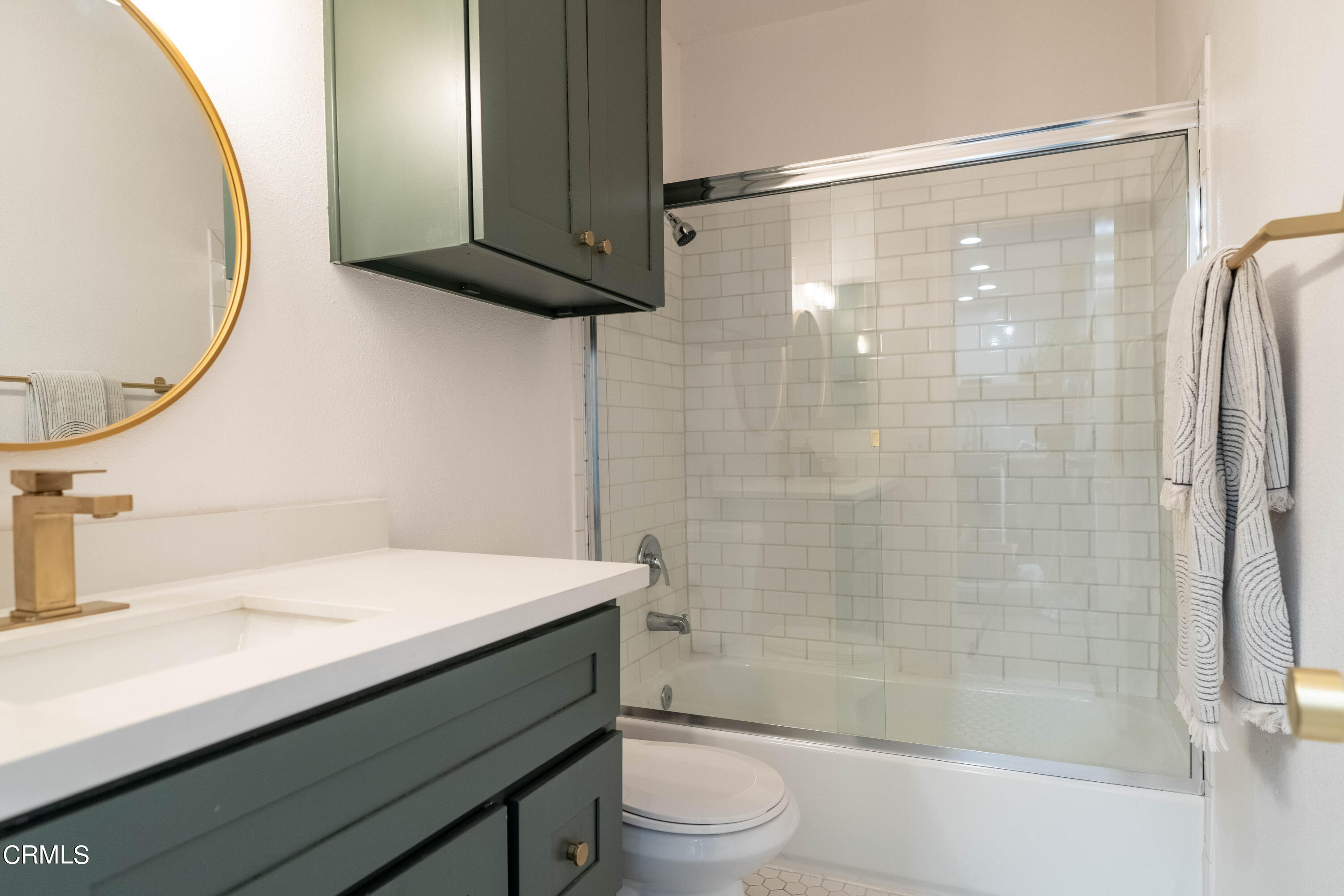 5850 Benner Street, Unit 306 Los Angeles, CA 90042 - Photo 10 of 29 a bathroom with a sink a toilet and shower