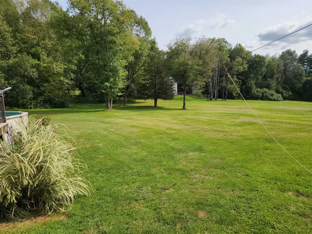 a view of a golf course with a trees