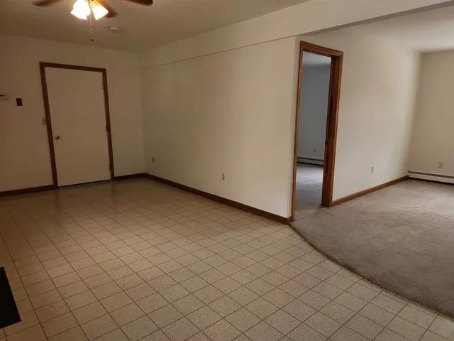 an empty room with fan