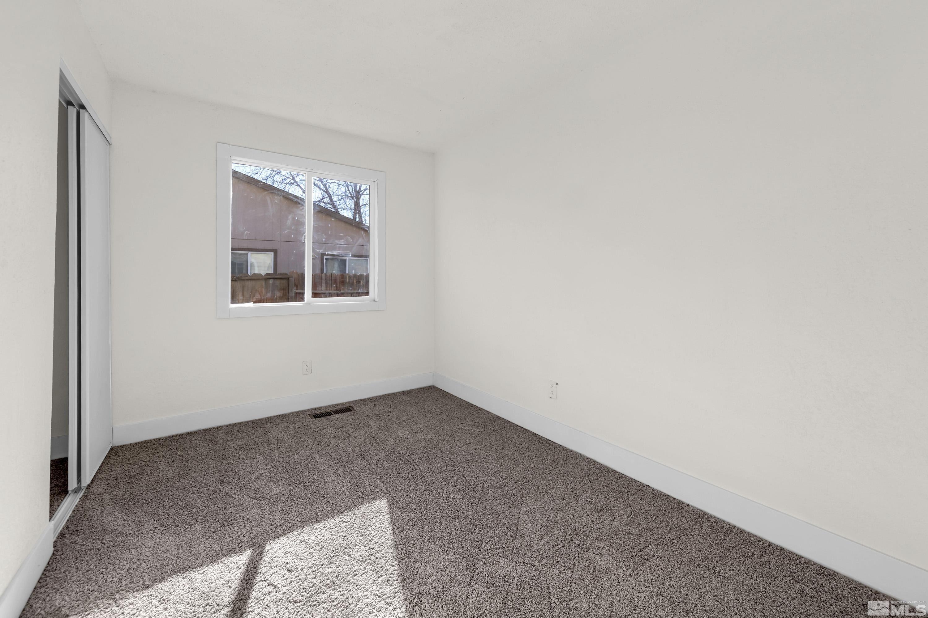 1349 Butler Street Reno, NV 89512 - Photo 27 of 36 an empty room with windows