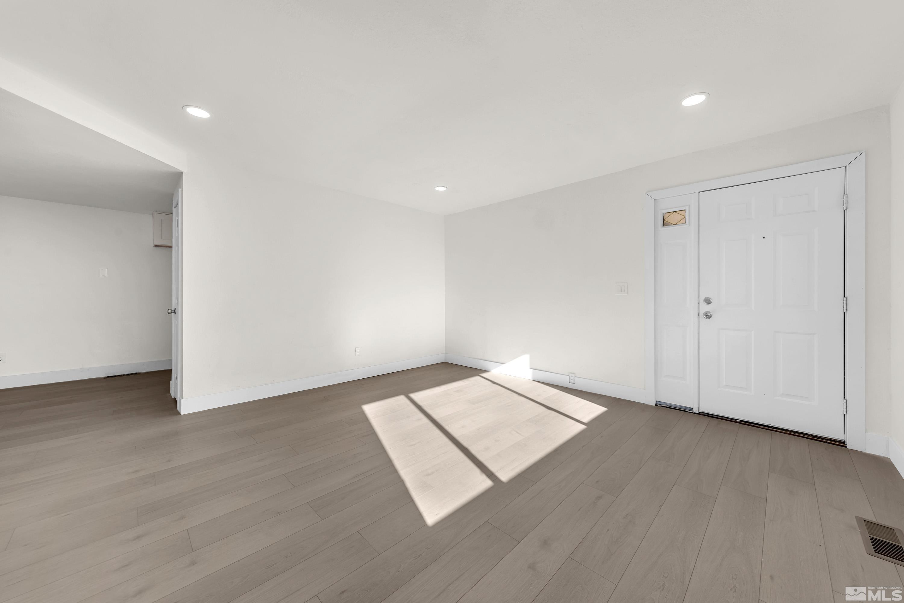 1349 Butler Street Reno, NV 89512 - Photo 8 of 36 an empty room with wooden floor
