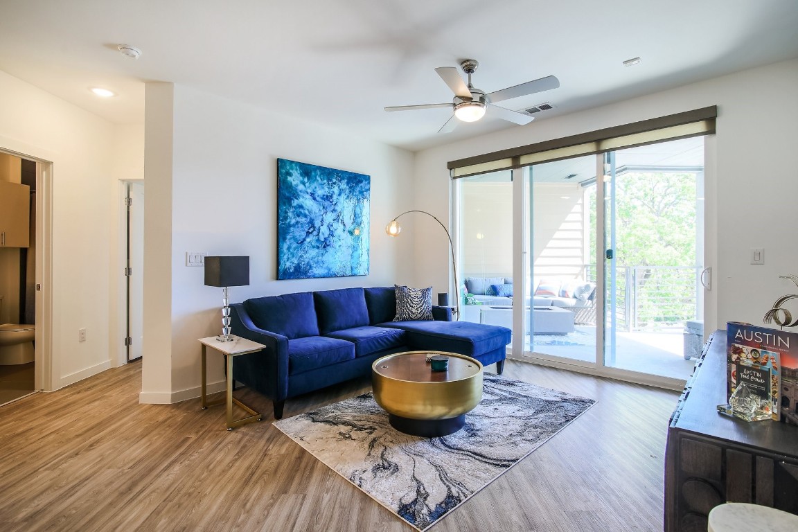 a living room with furniture and a large window
