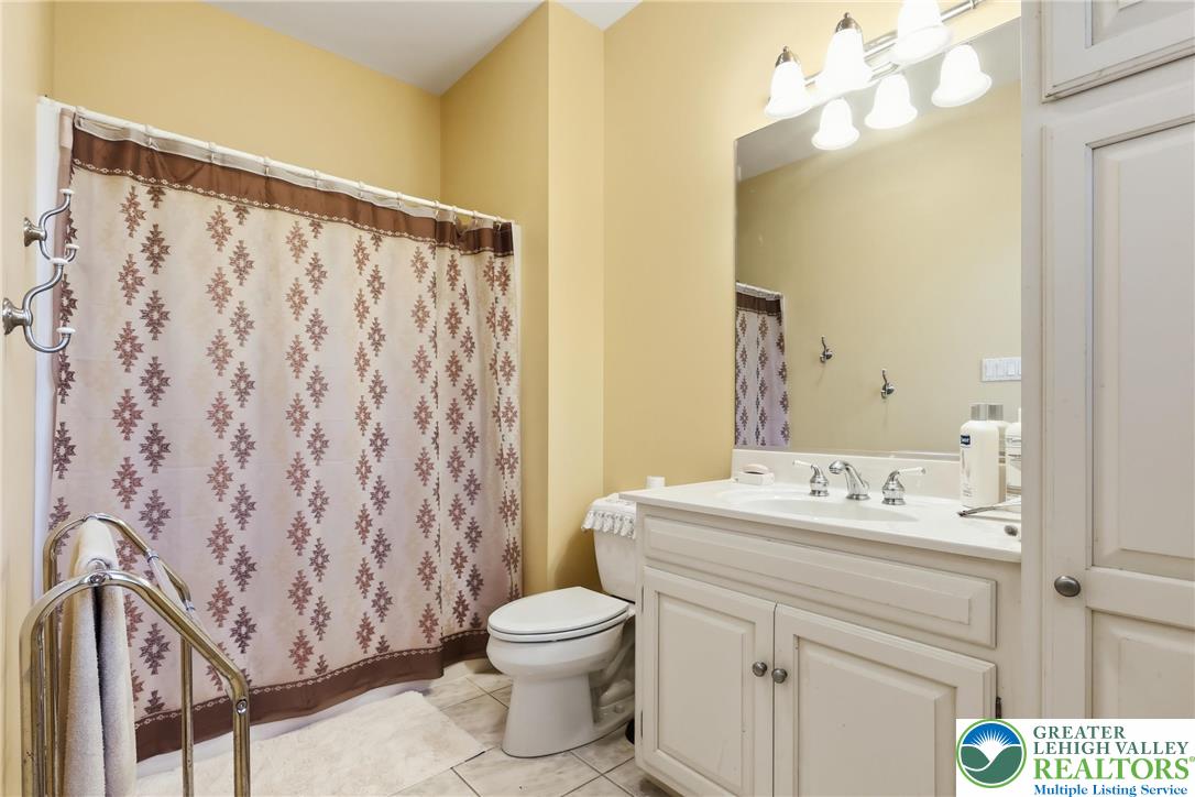 5217 Cider Press Road Schnecksville, PA 18078 - Photo 33 of 54 a bathroom with a sink a toilet and a mirror