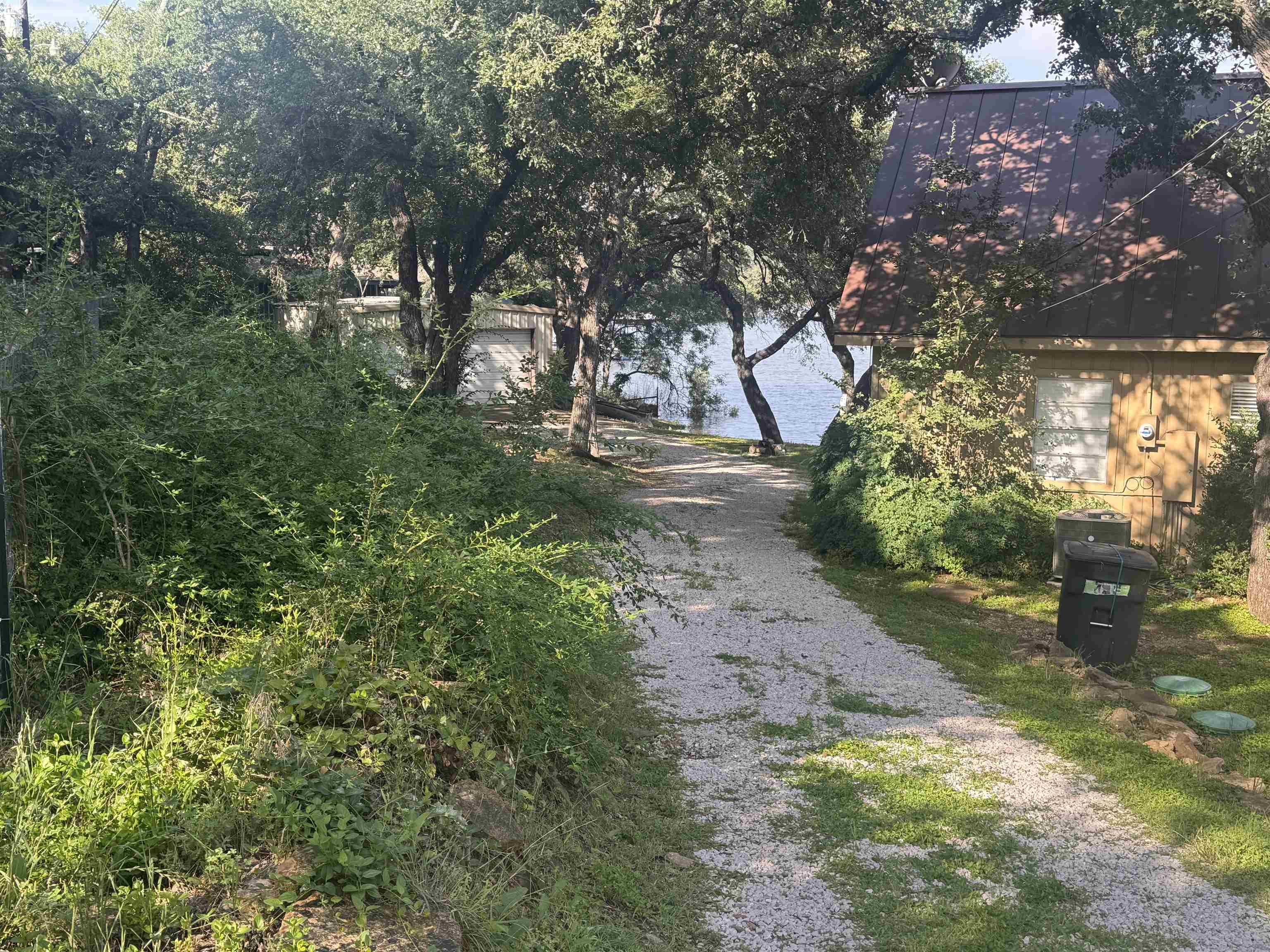 602 Sycamore Road Burnet, TX 78611 - Photo 2 of 26 a view of a yard with plants and trees