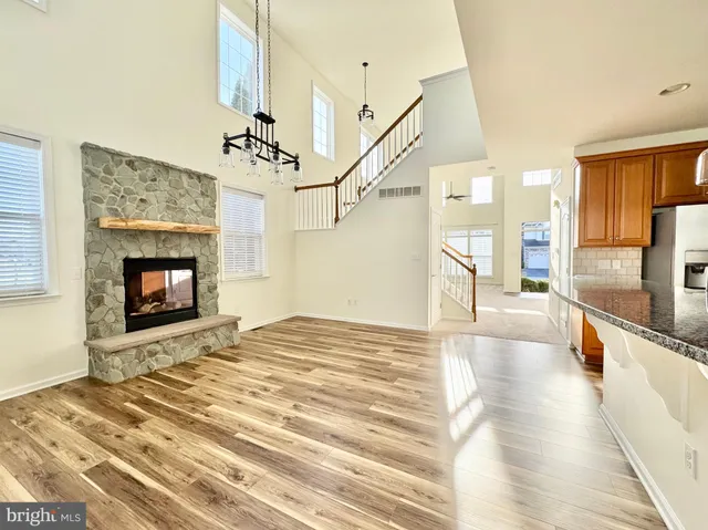 a view of an empty room and a fireplace