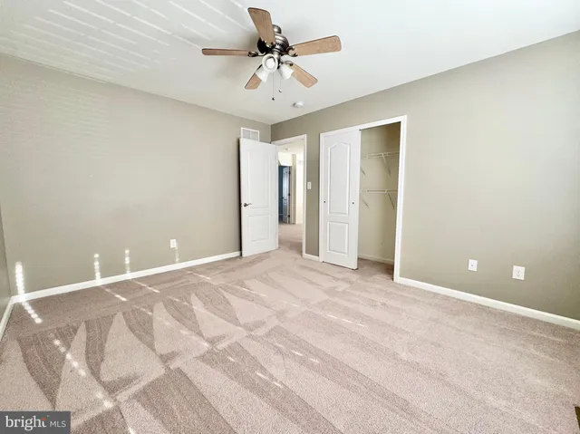a bathroom with a sink vanity and a mirror