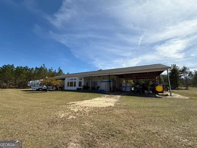 a view of a backyard of the house