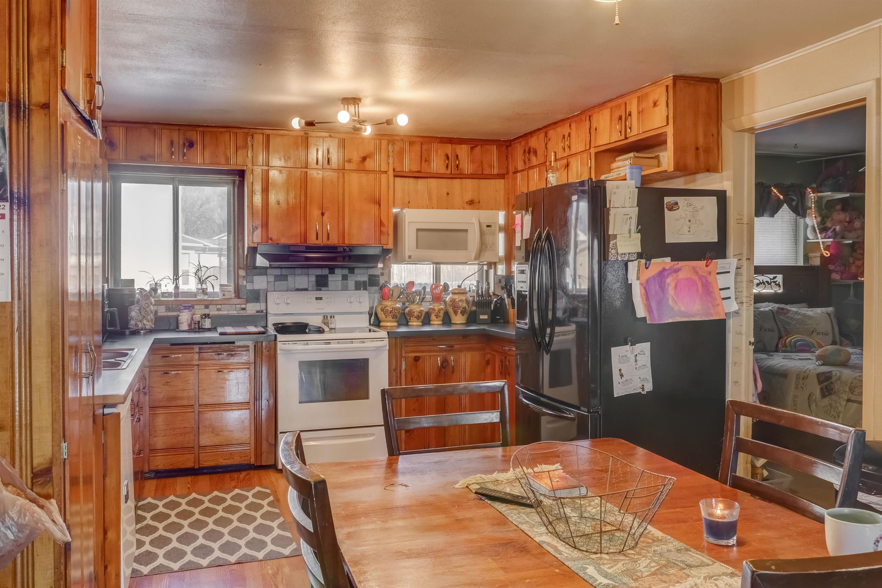 413 31 Road Grand Junction, CO 81504 - Photo 2 of 10 a kitchen with stainless steel appliances granite countertop a stove a sink and a refrigerator