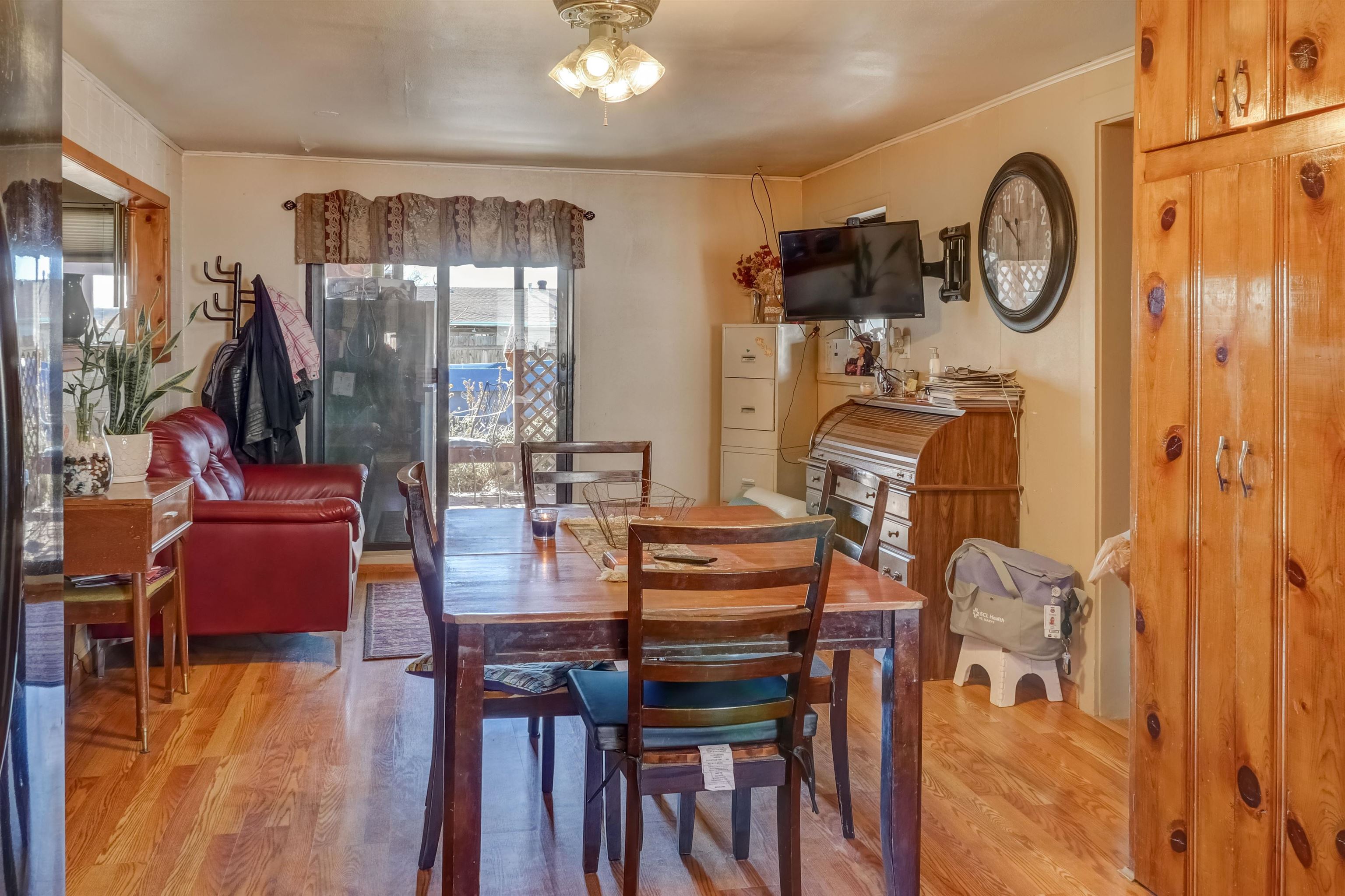 413 31 Road Grand Junction, CO 81504 - Photo 3 of 10 a dining room with furniture a chandelier and wooden floor