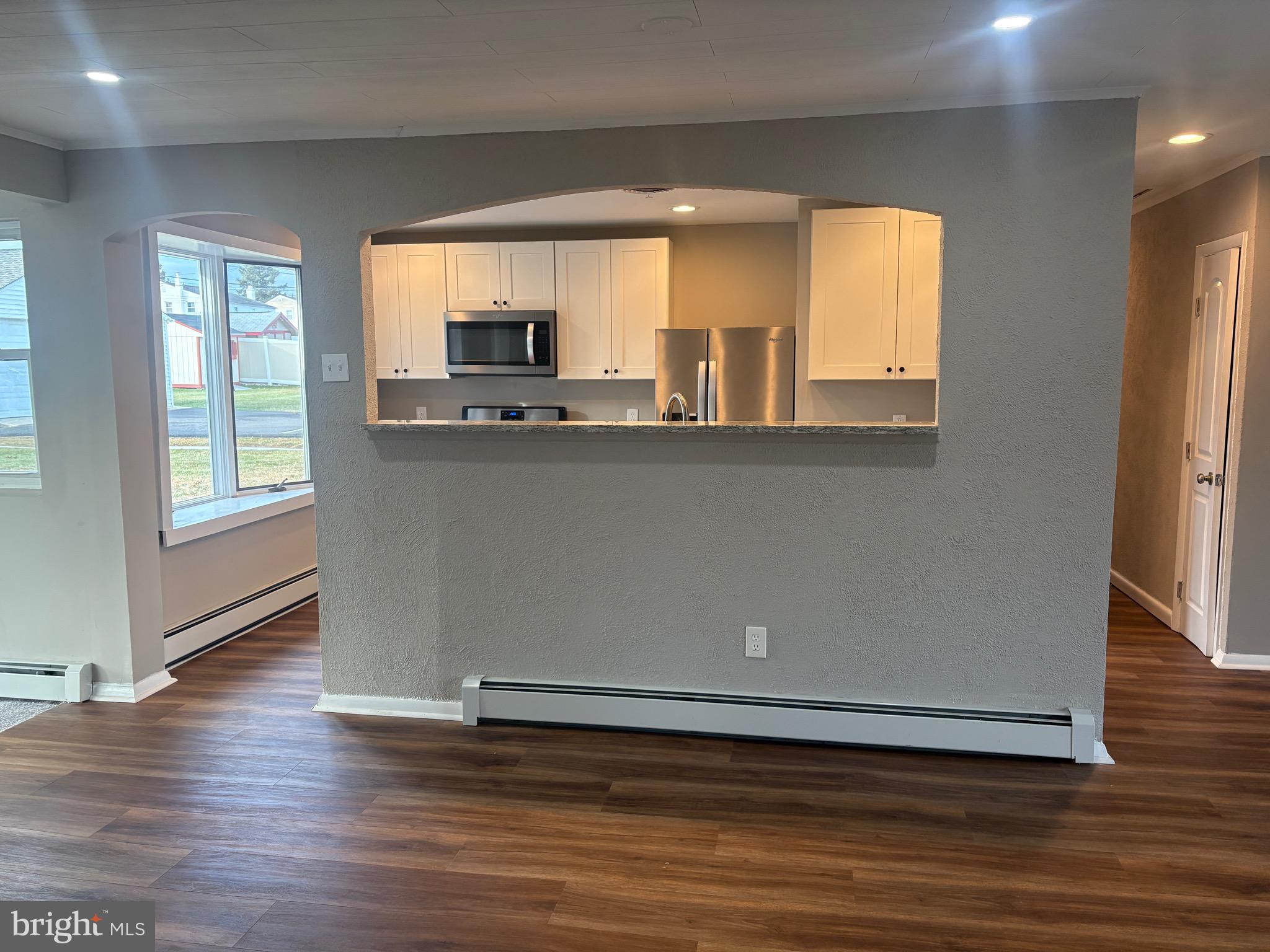 932 Rozel Avenue Southampton, PA 18966 - Photo 11 of 32 an empty room with wooden floor and windows