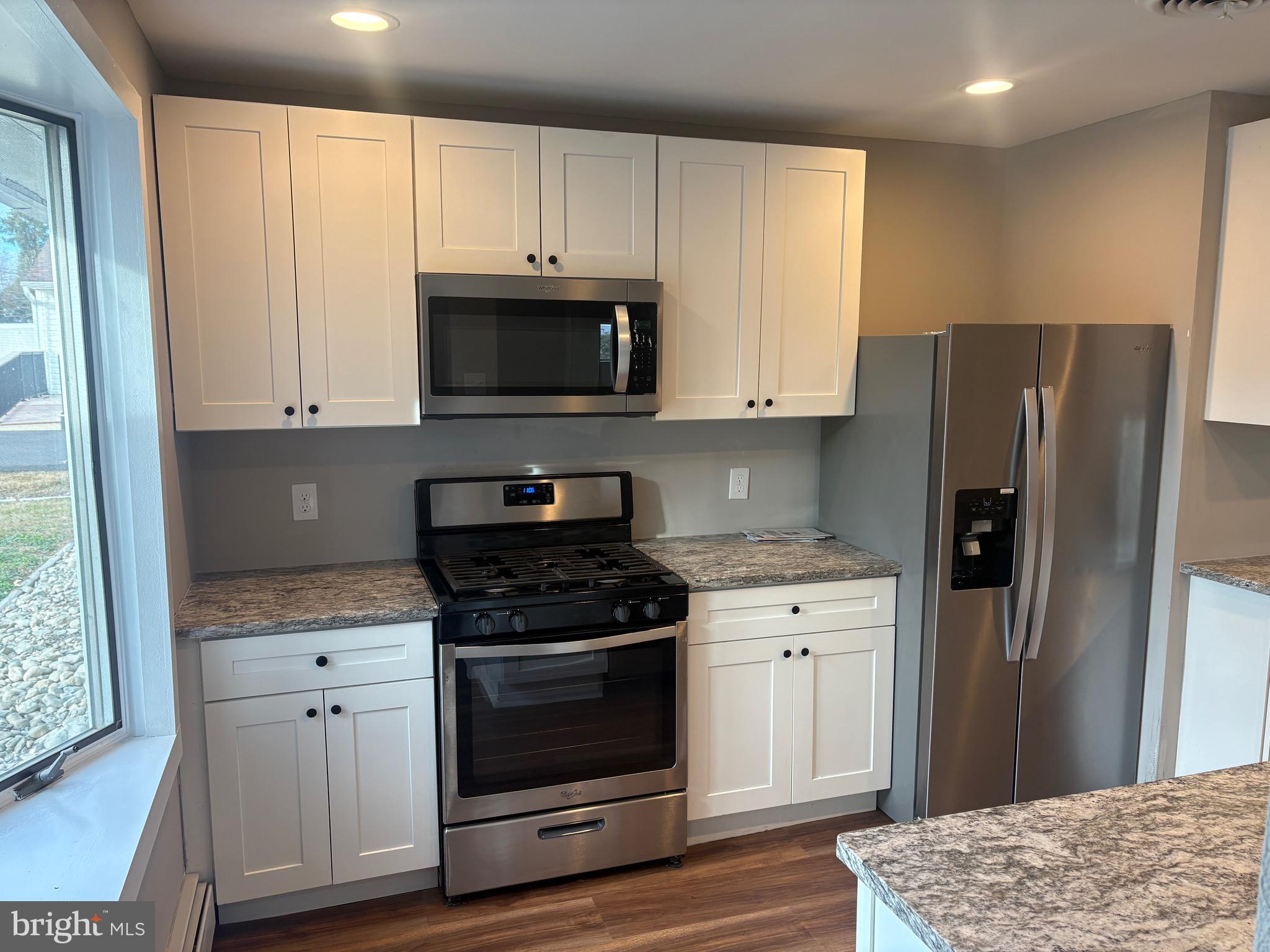 932 Rozel Avenue Southampton, PA 18966 - Photo 12 of 32 a kitchen with granite countertop white cabinets and stainless steel appliances