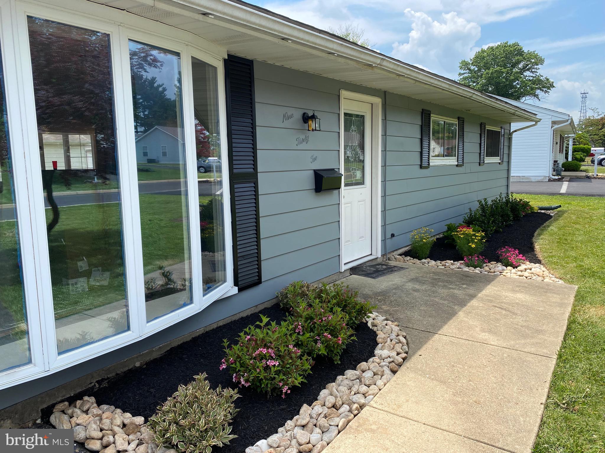932 Rozel Avenue Southampton, PA 18966 - Photo 2 of 32 a front view of a house with a yard and potted plants