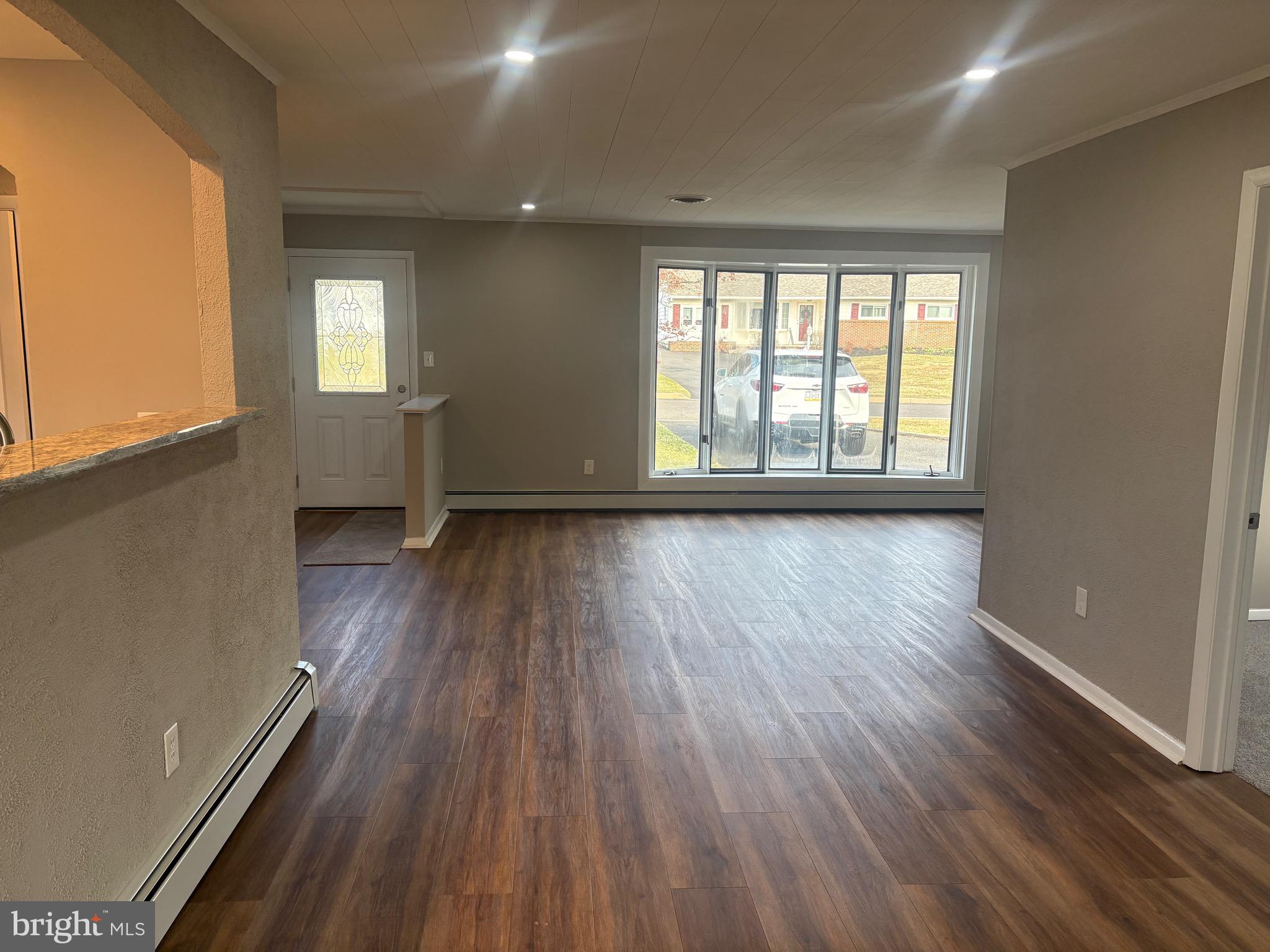 932 Rozel Avenue Southampton, PA 18966 - Photo 7 of 32 a view of an empty room with wooden floor and a window