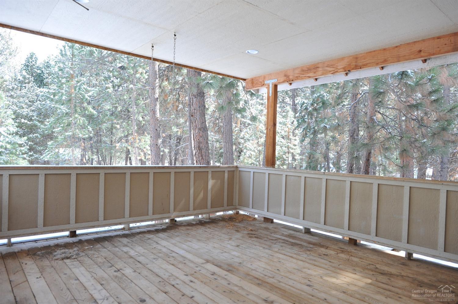 19100 Choctaw Road Bend, OR 97702 - Photo 18 of 19 an empty room with wooden floor and windows