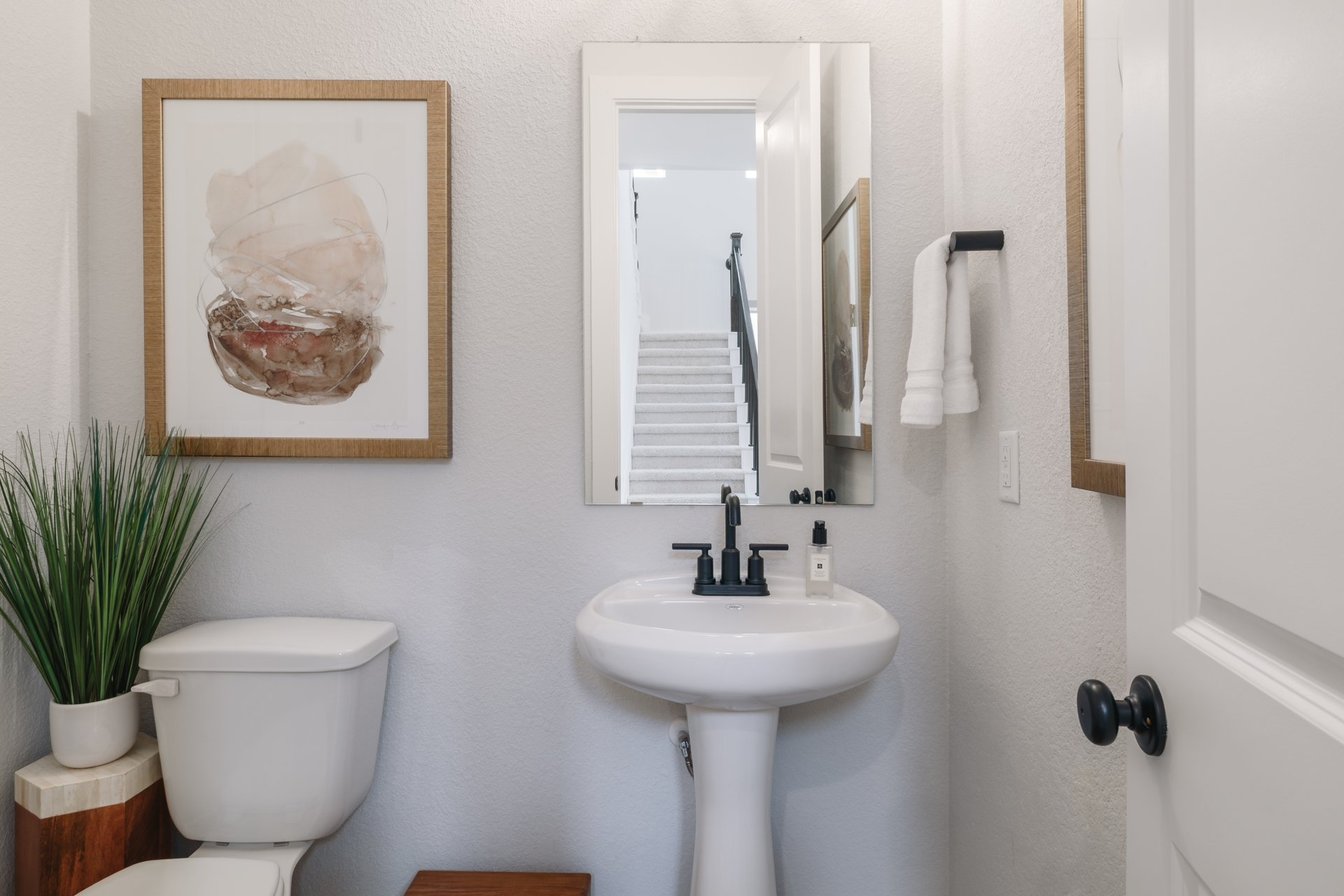 317 Autumn Oak Way Georgetown, TX 78628 - Photo 27 of 40 a bathroom with a toilet sink and mirror