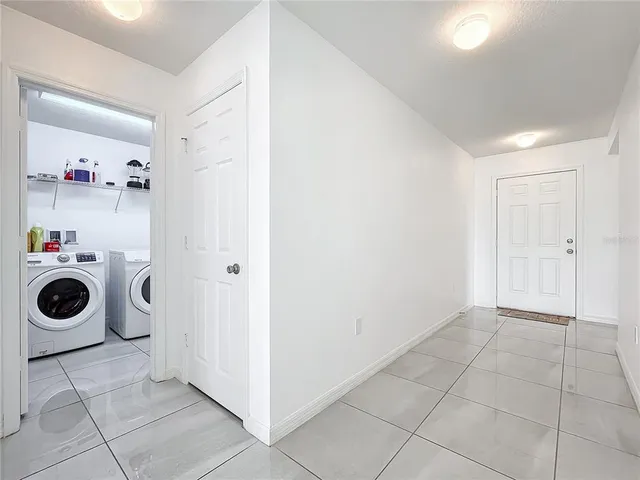 a view of a storage & utility room with washer and dryer