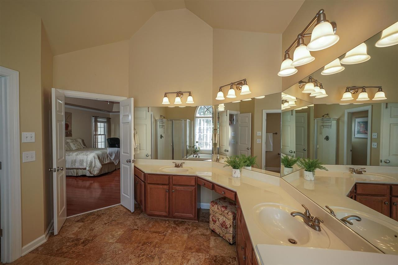 6000 Tiffield Way Wake Forest, NC 27587 - Photo 20 of 30 Large Owner's Bathroom with vaulted ceiling, tile floors, large double vanity, JETTED bathtub, separate shower and private toilet. Owner's Bath