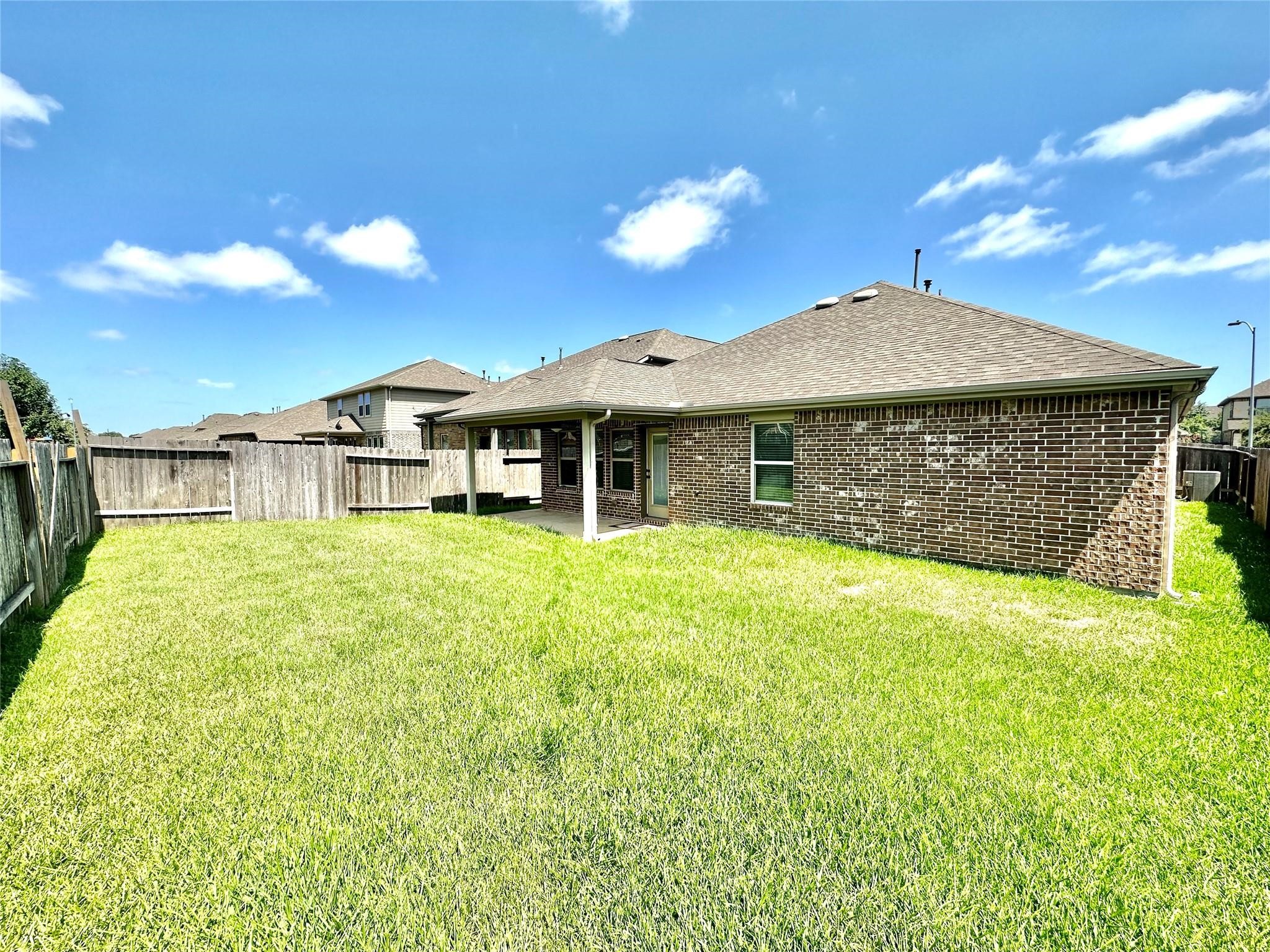 14818 Raleigh's Meadow Court Cypress, TX 77433 - Photo 17 of 17 a front view of a house with a garden