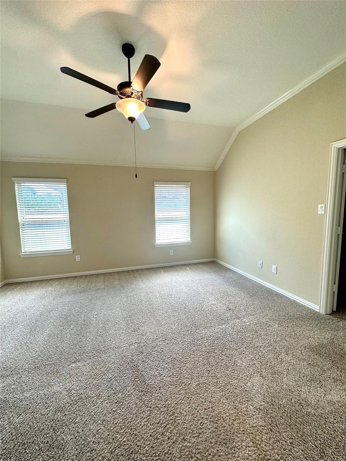 14818 Raleigh's Meadow Court Cypress, TX 77433 - Photo 6 of 17 a view of a big room with windows and chandelier fan