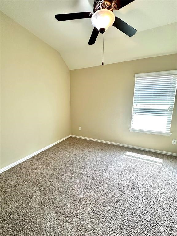 14818 Raleigh's Meadow Court Cypress, TX 77433 - Photo 10 of 17 an empty room with a window and a fan