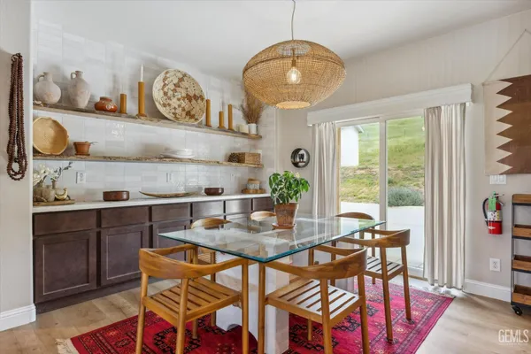 a kitchen with a cabinets and wooden floor