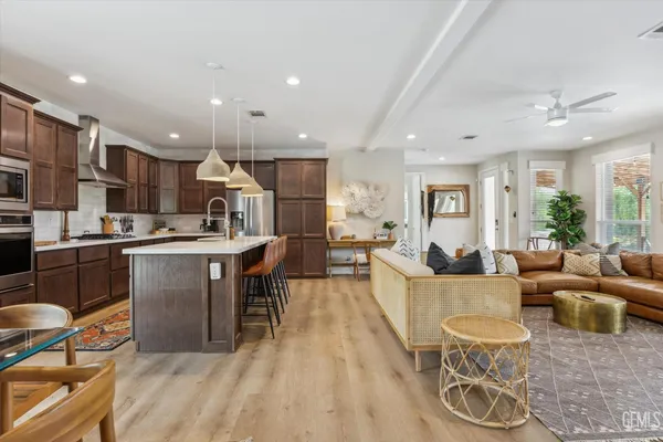 a large kitchen with a table and chairs