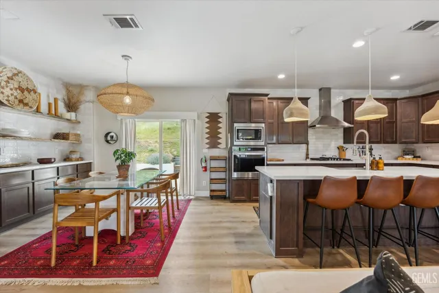 a bedroom with a large bed and a potted plant