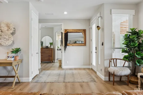 a spacious bedroom with a bed and a large window