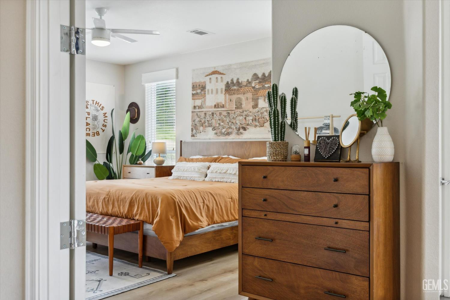 Undisclosed Address Keene, CA 93531 - Photo 24 of 60 a bedroom with a large bed and a potted plant