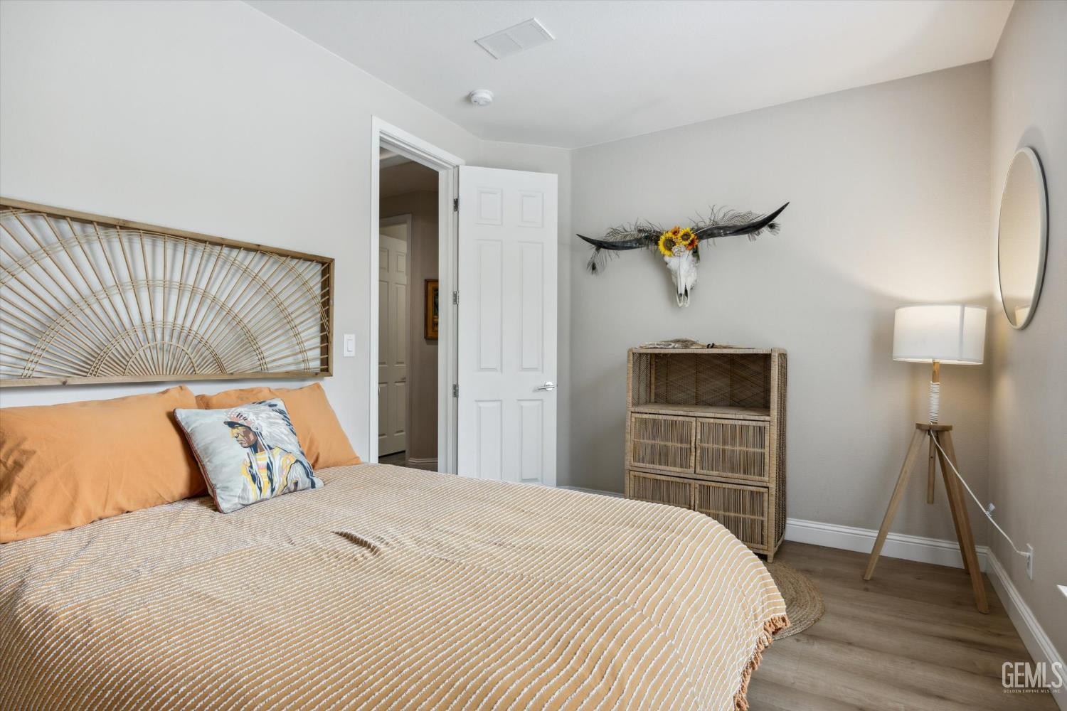 Undisclosed Address Keene, CA 93531 - Photo 32 of 60 a bedroom with a large bed and a chandelier