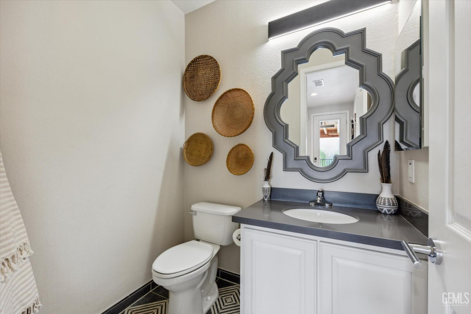 Undisclosed Address Keene, CA 93531 - Photo 35 of 60 a bathroom with a toilet mirror and sink