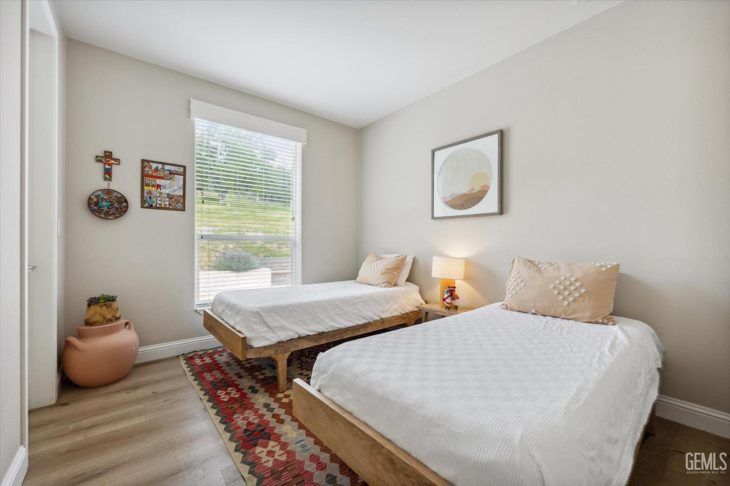 Undisclosed Address Keene, CA 93531 - Photo 36 of 60 a bedroom with two beds and a wooden floor