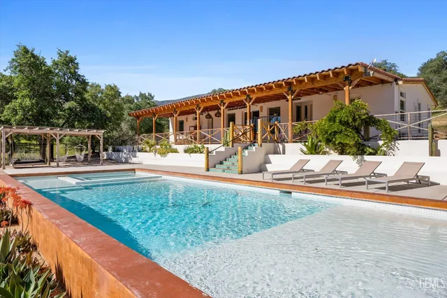 a view of house with outdoor space and seating area