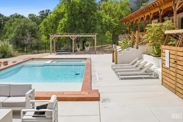 a view of swimming pool with a patio