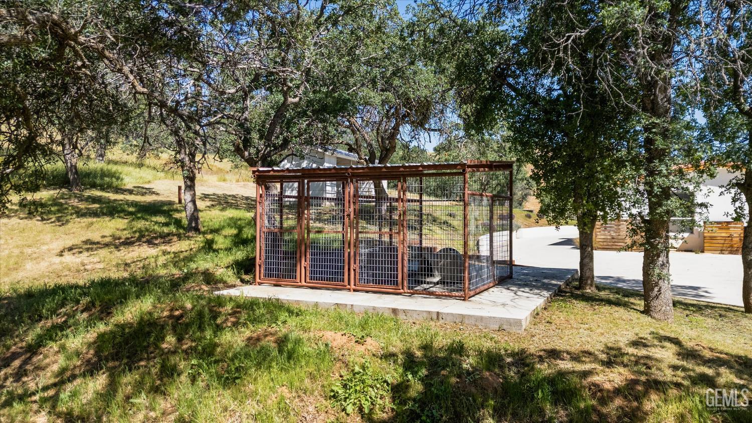 Undisclosed Address Keene, CA 93531 - Photo 49 of 60 a view of a yard with large trees