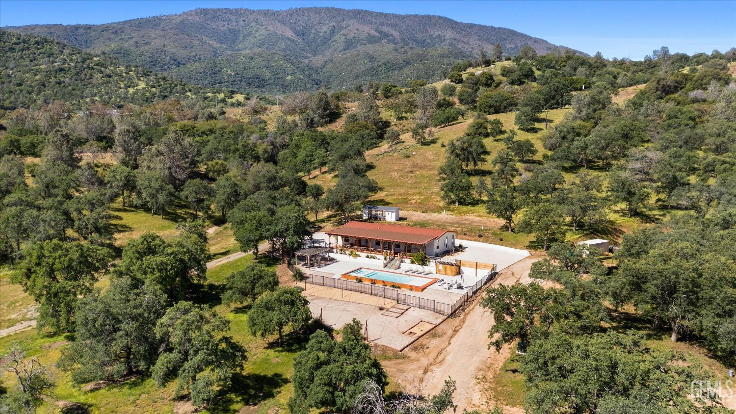 Undisclosed Address Keene, CA 93531 - Photo 53 of 60 an aerial view of residential houses with outdoor space and trees
