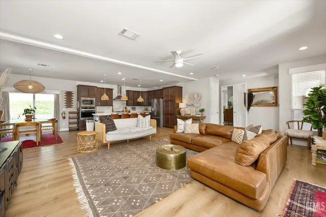 a living room with fireplace furniture and a flat screen tv